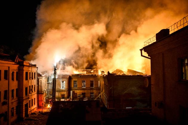 A rescuer uses an aerial work platform to extinguish a fire at Academic Building No. 3 of Zaporizhzhia National University, caused by an overnight Russian drone attack in the Oleksandrivskyi district of Zaporizhzhia, Ukraine, September 21, 2026. The building, a cultural heritage site and architectural monument of local significance, was formerly the Oleksandrivsk Girls’ Gymnasium, built in 1902. A significant portion of the historic structure burned down in the attack. Buildings No. 4 and No. 5 also sustained damage, with windows shattered. The Russian strike additionally destroyed a shopping centre and damaged multi-storey residential blocks. Six people were injured. (Photo by Dmytro Smolienko Ukrinform) Historic building of Zaporizhzhia N  Copyright: xDmytroxSmolienkox