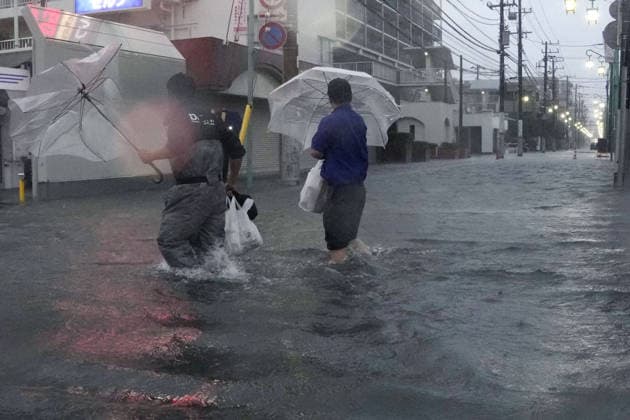 Typhoon in eastern Japan A street in Ichikawa near Tokyo is flooded on Sept. 21, 2026, due to Typhoon Dujuan.  A14AA0005628192P