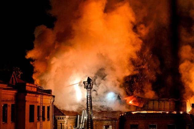 Historic Building of Zaporizhzhia National University Struck by Russian Army - Ukraine A rescuer uses an aerial work platform to extinguish a fire at Academic Building No. 3 of Zaporizhzhia National University, caused by an overnight Russian drone attack in the Oleksandrivskyi district of Zaporizhzhia, Ukraine, September 21, 2026. The building, a cultural heritage site and architectural monument of local significance, was formerly the Oleksandrivsk Girls? Gymnasium, built in 1902. A significant portion of the historic structure burned down in the attack. Buildings No. 4 and No. 5 also sustained damage, with windows shattered. The Russian strike additionally destroyed a shopping centre and damaged multi-storey residential blocks. Six people  Copyright: xSmoliyenkoxDmytro Ukrinform ABACAx