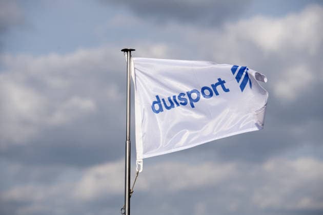 A flag bearing the Duisport logo fluttering in the wind; Jochen OTT, SPD parliamentary group leader in the North Rhine-Westphalia state parliament, the top candidate for the 2027 state election, visits Duisport Duisburger Hafen AG to learn about the role of logistics in the energy transition and the importance of inland waterway transport for North Rhine-Westphalia on September 21, 2026, in Duisburg, Ger