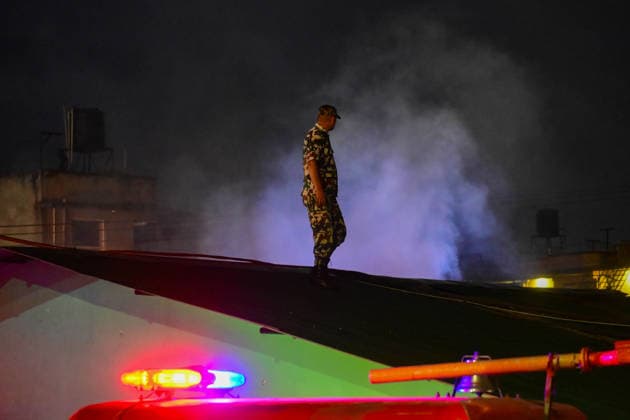 Nepal: Fire Breaks Out At Plastic Warehouse In Kathmandu Security personnel from the Nepal Army, Armed Police Force (APF) and Nepal Police, along with firefighters from Kathmandu Metropolitan City, work to extinguish a fire at a plastic warehouse near residential houses and the waste-management centre in Teku, Kathmandu, Nepal, on September 21, 2026. The fire broke out at a plastic warehouse in Kathmandu Metropolitan City-12, with firefighters, security personnel and local residents working to control the blaze. The cause of the fire and the extent of the damage were not immediately known. Kathmandu Bagmati Nepal  Copyright: xSafalxPrakashxShresthax originalFilename: shrestha-nepalfir260921_npBfT.jpg