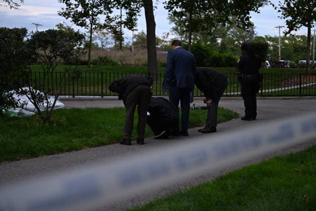 September 21, 2026, Far Rockaway, Queens, New York, USA: NYPD officers work the scene where a 14-year-old boy was shot at 430 Beach 54 Street in Far Rockaway, Queens, New York, United States on Monday, September 21, 2026. The shooting happened after 3:30 pm and the victim was transported to LI Jewish Hospital Cohen and was originally listed in critical condition. A scooter and shell casings were found at the scene. There are no arrests and the investigation is ongoing by the NYPD. Far Rockaway, Queens USA - ZUMAs197 20260921_aaa_s197_096 Copyright: xKylexMazzax