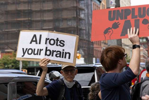 September 21, 2026: A coalition of climate organizations led by Climate Defenders hold an anti AI rally outside the offices of OpenAI in Lower Manhattan s Soho neighborhood at the start of Climate Week. Attendees hold signs that read AI rots your brain UNPLUG AI. Demonstrators denounce OpenAIÃ¢â‚¬â ¢s massive data center buildout for causing higher utility bills, pollution, depleting water supplies and for worsening the climate crisis by creating a larger demand for fossil fuels. Protesters call for elected government officials to regulate Artificial Intelligence and pass data center moratoriums to protect communities and the planet from Big Tech. - ZUMAr174 20260921_znp_r174_012 Copyright: xGinaxMxRandazzox