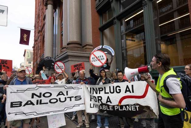 September 21, 2026: A coalition of climate organizations led by Climate Defenders hold an anti AI rally outside the offices of OpenAI in Lower Manhattan s Soho neighborhood at the start of Climate Week. Attendees hold signs and banners that read NO AI BAILOUTS UNPLUG AI FOR A LIVABLE PLANET circle slash (no) AI DATA CENTERS. Demonstrators denounce OpenAIÃ¢â‚¬â ¢s massive data center buildout for causing higher utility bills, pollution, depleting water supplies and for worsening the climate crisis by creating a larger demand for fossil fuels. Protesters call for elected government officials to regulate Artificial Intelligence and pass data center moratoriums to protect communities and the planet from Big Tech. - ZUMAr174 20260921_znp_r174_014 Copyright: xGinaxMxRandazzox