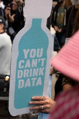 September 21, 2026: A coalition of climate organizations led by Climate Defenders hold an anti AI rally outside the offices of OpenAI in Lower Manhattan s Soho neighborhood at the start of Climate Week. An attendee holds a water bottle shaped sign that reads YOU CAN T DRINK DATA. Demonstrators denounce OpenAIÃ¢â‚¬â ¢s massive data center buildout for causing higher utility bills, pollution, depleting water supplies and for worsening the climate crisis by creating a larger demand for fossil fuels. Protesters call for elected government officials to regulate Artificial Intelligence and pass data center moratoriums to protect communities and the planet from Big Tech. - ZUMAr174 20260921_znp_r174_026 Copyright: xGinaxMxRandazzox