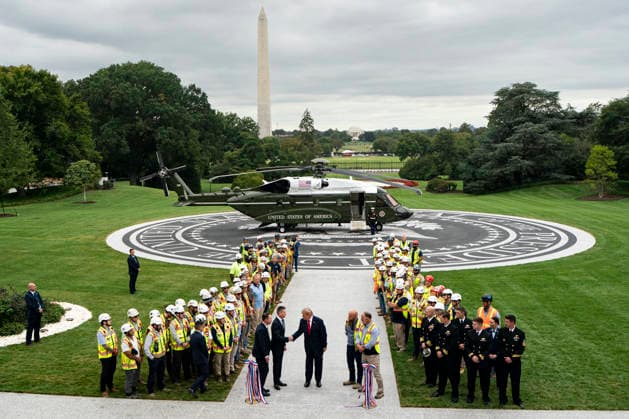 President Donald Trump shakes hands with Jim Taiclet, chairman and chief executive officer of Lockheed Martin Corp., during a ribbon-cutting ceremony for the new helipad on the South Lawn of the White House in Washington, DC on Monday, September 21, 2026. The new Marine One, a Sikorsky VH-92A Patriot, has an exhaust vent that could have scorched the White House grass.  WASP20260921107 AlxDrago