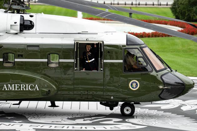A member of the Marine Helicopter Squadron One (HMX-1) opens the door of the new Marine One, a Sikorsky VH-92A Patriot, ahead of a ribbon-cutting ceremony for the new helipad on the South Lawn of the White House in Washington, DC on Monday, September 21, 2026.  WASP20260921121 AlxDrago