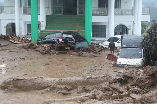 Flash Floods devastate Solok Regency in West Sumatra, Indonesia SOLOK, INDONESIA - SEPTEMBER 22: Mud and debris surround damaged vehicles and buildings following flash floods in Solok Regency, West Sumatra, on September 22, 2026 in Solok, Indonesia. The floods damaged homes, a mosque and rice fields and cut road access in parts of the area. One person remains missing following the disaster, according to rescue officials. Adi Prima Anadolu Solok Indonesia. Editorial use only. Please get in touch for any other usage.  Copyright: x2026xAnadoluxAdixPrimax