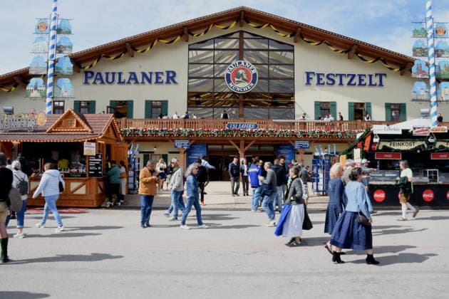 Munich, September 21, 2026: Thersienwiesn Oktoberfest visitors in front of the Paulaner tent. Photo: Munich