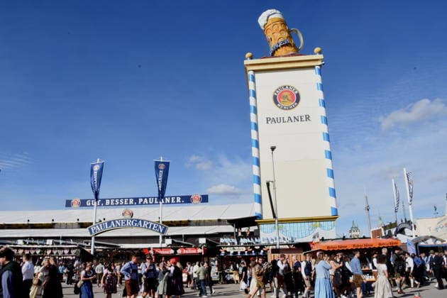 Munich, September 21, 2026: Thersienwiesn Oktoberfest visitors in front of the Paulaner tent. Photo: Munich