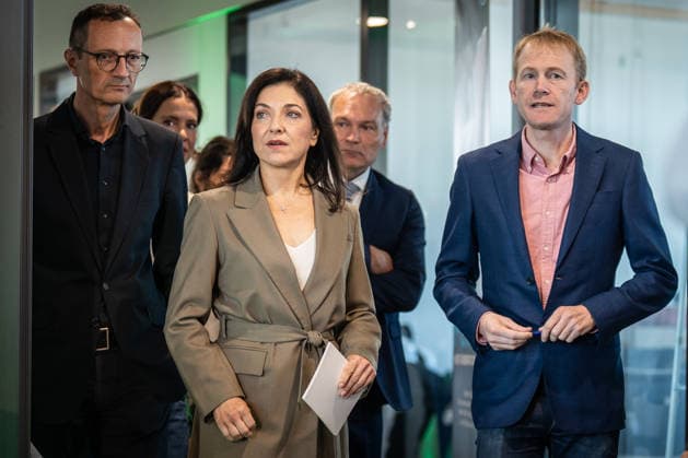 Katherina Reiche, German Federal Minister for Economic Affairs and Energy, delivers a welcoming address at the opening of the production facility, alongside Will Marshall, co-founder and CEO of Planet Labs (right), Walther Pelzer, Executiv