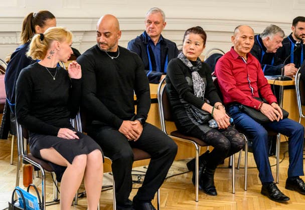 The trial in a major case involving the smuggling of migrants from Asia through the Czech Republic to Germany began today, on September 22, 2026, at the District Court in Litomerice, Czech Republic. There are 13 defendants. One of the defendants, described by the prosecutor as the main organiser of the migrant smuggling operation, is in custody. The group smuggled at least 63 refugees. If convicted, the defendants face between two and eight years in prison. Some of defendants and interpreter sit in the front row. (CTKxPhoto OndrejxHajek) CTKPhotoP2026092202756  CTKPhotoP2026092202756