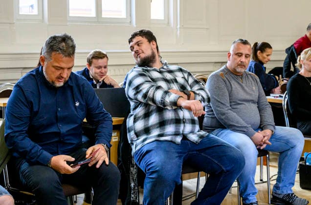 The trial in a major case involving the smuggling of migrants from Asia through the Czech Republic to Germany began today, on September 22, 2026, at the District Court in Litomerice, Czech Republic. There are 13 defendants. One of the defendants, described by the prosecutor as the main organiser of the migrant smuggling operation, is in custody. The group smuggled at least 63 refugees. If convicted, the defendants face between two and eight years in prison. Three of defendants are in the front row. (CTKxPhoto OndrejxHajek) CTKPhotoP2026092202759  CTKPhotoP2026092202759
