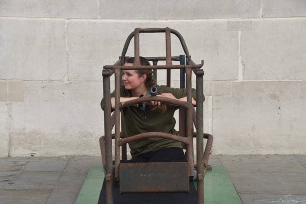 September 22, 2026, London, England, United Kingdom: The activist MICHELLE FARNHAM sits inside a farrowing crate in Trafalgar Square on the final day of a protest against pig crates and factory farms organised by the animal rights group Animal Rising. The activist lived in the crate for three weeks, demonstrating how mother pigs live on factory farms, and calling for an end to farrowing crates and a pig named Luna to be freed. London United Kingdom  - ZUMAv130 20260922_zip_v130_007 Copyright: xVukxValcicx