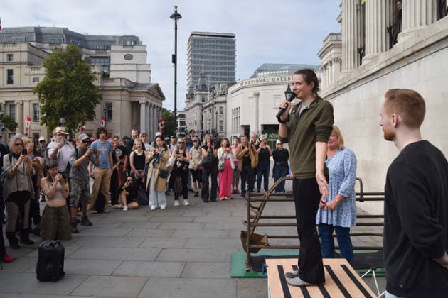 September 22, 2026, London, England, United Kingdom: The activist MICHELLE FARNHAM gives a speech after leaving the farrowing crate in Trafalgar Square on the final day of a protest against pig crates and factory farms organised by the animal rights group Animal Rising. The activist lived in the crate for three weeks, demonstrating how mother pigs live on factory farms, and calling for an end to farrowing crates and a pig named Luna to be freed. London United Kingdom  - ZUMAv130 20260922_zip_v130_017 Copyright: xVukxValcicx