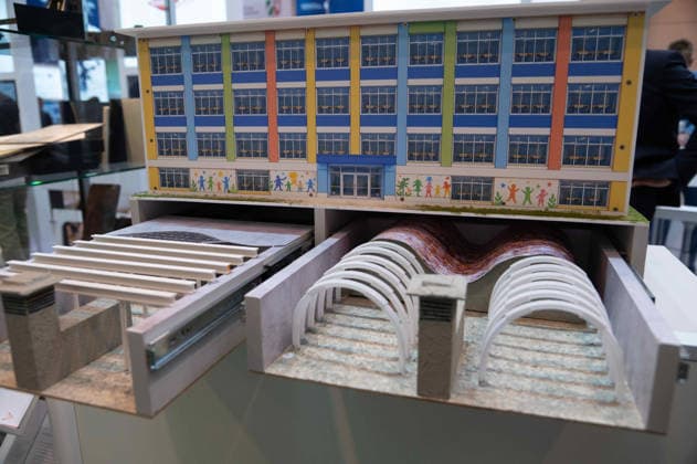 Model of a school building with shelters in the basement; the manufacturer is showcasing the construction and retrofitting of bunker facilities here at the EUDEX Euro Defense Expo on September 22, 2026, at the Essen Exhibition Center in Germany