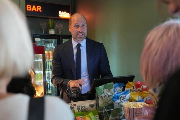 Britain Royals Prince William serves customers popcorn as he visits ActOne, an independent, community-led cinema to celebrate the richness and talent of the British film industry, in London, Tuesday, Sept. 22, 2026. (AP Photo Kin Cheung, Pool), Credit:AG PA ROTA - B68 Avalon GBR, London  Copyright: xAGx xPAxROTAx-xB68x xAvalonx 1137241865