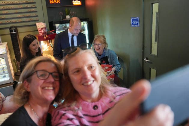 Britain Royals Two customers take a picture with their phone as Prince William visits ActOne, an independent, community-led cinema to celebrate the richness and talent of the British film industry, in London, Tuesday, Sept. 22, 2026. (AP Photo Kin Cheung, Pool), Credit:AG PA ROTA - B68 Avalon GBR, London  Copyright: xAGx xPAxROTAx-xB68x xAvalonx 1137241879