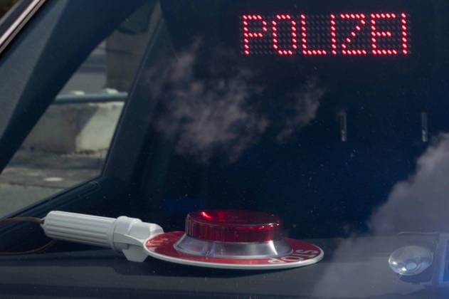 POLICE lettering, police baton, and blue light in an unmarked police vehicle; feature; background motif; symbolic photo; EUDEX Euro Defense Expo trade show, on September 22, 2026, at Messe Essen, Germany