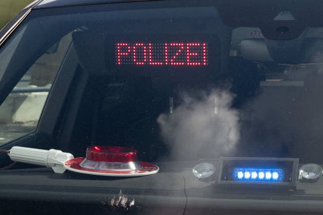 POLICE lettering, police baton, and blue light in an unmarked police vehicle; feature; background motif; symbolic photo; EUDEX Euro Defense Expo trade show, on September 22, 2026, at Messe Essen, Germany