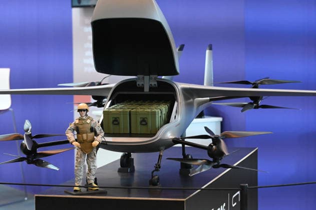Model of a transport drone, transport drone, with a soldier figure in front of it, EUDEX Euro Defense Expo, on September 22, 2026, at Messe Essen, Germany