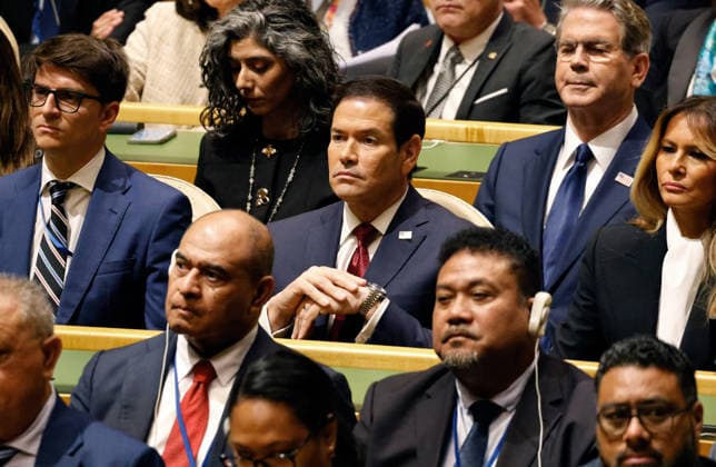 Unites States Secretary of State Marco Rubio, center listens to US President Donald Trump speak at the UN General Assembly 81st session General Debate in UN General Assembly Hall at the United Nations Headquarters on Tuesday, September 22, 2026 in New York City.  NYP202609224020 PETERxFOLEY