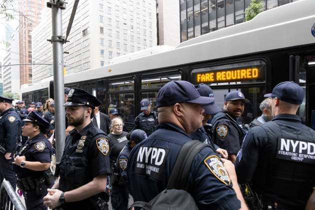 September 22, 2026, New York, New York, USA: Anti-Trump demonstrators block traffic on Second Avenue near the United Nations in Midtown Manhattan as President Trump is expected to arrive for his address at the U.N. General Assembly, resulting in 23 arrests by NYPD. Arrested protesters are put on an MTA bus for transport to the police station. Members of Rise and Resist demonstrate under the banner Trump does not speak for us Trump is a war criminal. New York USA - ZUMAr174 20260922_znp_r174_033 Copyright: xGinaxMxRandazzox
