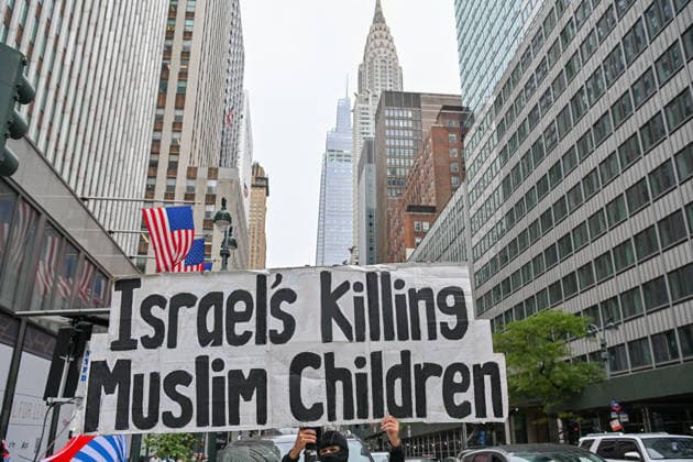 Demonstrators protest near UN Headquarters in New York NEW YORK, UNITED STATES - SEPTEMBER 22: Demonstrators hold an anti-Israel banner outside the Israeli mission near the United Nations headquarters in New York, United States, during a protest against a new law mandating the use of Mandarin in schools and institutions, which Tibetans say threatens their identity, culture and native language, ahead of the 81st session of the UN General Assembly, on September 22, 2026. Waleed Zein Anadolu New York United States. Editorial use only. Please get in touch for any other usage.  Copyright: x2026xAnadoluxWaleedxZeinx