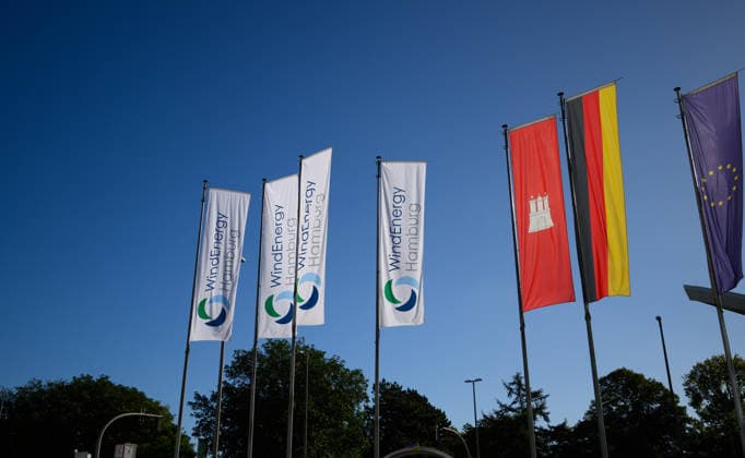 WindEnergy Hamburg flags in front of the Hamburg Messe Hamburg, Germany; WindEnergy Hamburg flags, along with the Hamburg state flag, the German flag, and the flag of the European Union, in front of the Hamburg Messe Hamburg grounds, Hamburg, Germany 20260922_Z9B_6901