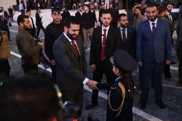 Syria’s Women’s Police Academy graduates its first class DAMASCUS, SYRIA - SEPTEMBER 22: Syrian Interior Minister Anas Khattab (L) shakes hands with a child wearing a police uniform during a graduation ceremony held at the Interior Ministry building for 150 female police cadets who completed six months of training at the Women’s Police Academy affiliated with the Syrian Interior Ministry, marking the academy’s first graduating class, in Damascus, Syria, on September 22, 2026. Izz Aldien Alqasem Anadolu Damascus Syria. Editorial use only. Please get in touch for any other usage.  Copyright: x2026xAnadoluxIzzxAldienxAlqasemx
