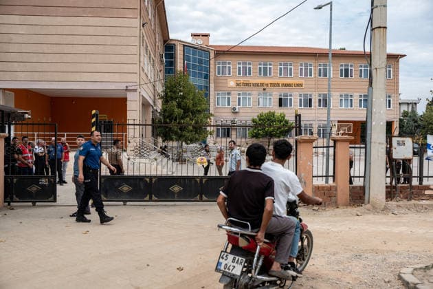 September 22, 2026, Manisa, Turkey: Police officers stand guard outside the high school following a shooting. Police maintained security measures around a high school in Turgutlu, in Turkey™s western Manisa province, following a shooting that left 11 people injured. The Turkish Interior Minister and Education Minister addressed the media following the incident. Manisa Turkey - ZUMAs197 20260922_aaa_s197_448 Copyright: xMuratxKocabasx