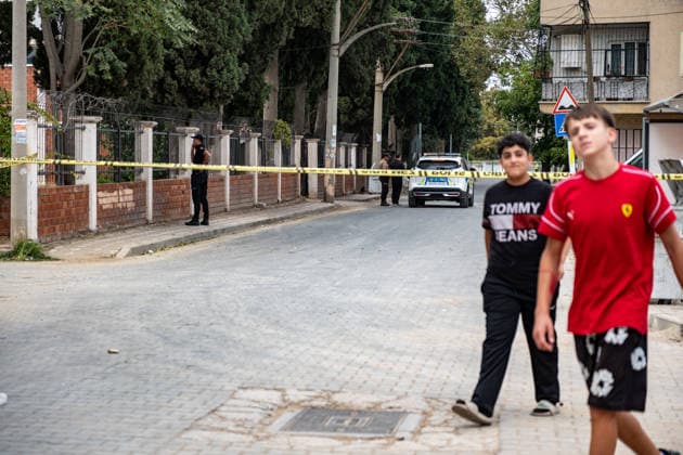 September 22, 2026, Manisa, Turkey: Children walk past a Do Not Enter police tape. Police maintained security measures around a high school in Turgutlu, in Turkey™s western Manisa province, following a shooting that left 11 people injured. The Turkish Interior Minister and Education Minister addressed the media following the incident. Manisa Turkey - ZUMAs197 20260922_aaa_s197_472 Copyright: xMuratxKocabasx