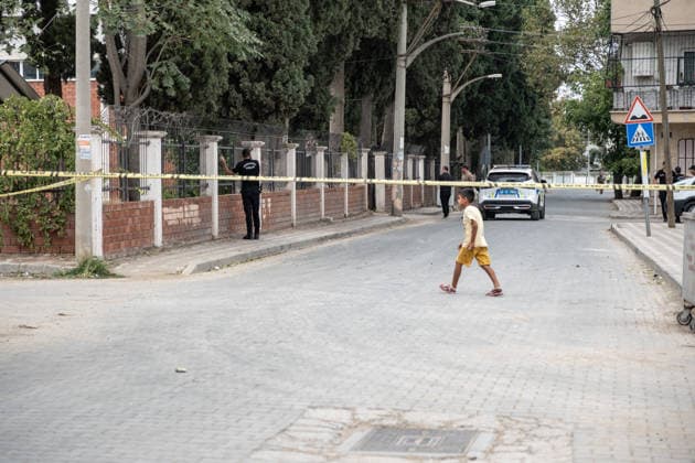 September 22, 2026, Manisa, Turkey: A child walks past police crime scene tape. Police maintained security measures around a high school in Turgutlu, in Turkey™s western Manisa province, following a shooting that left 11 people injured. The Turkish Interior Minister and Education Minister addressed the media following the incident. Manisa Turkey - ZUMAs197 20260922_aaa_s197_467 Copyright: xMuratxKocabasx