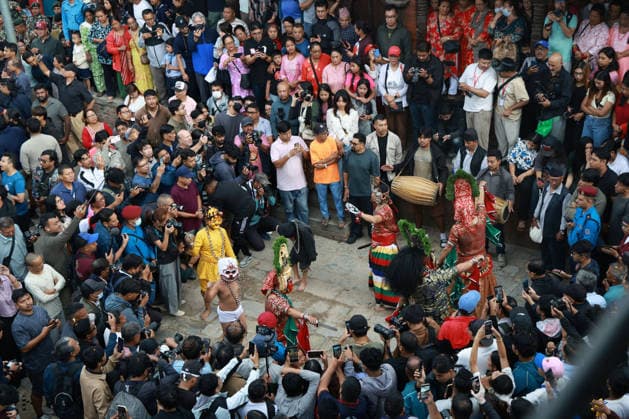 September 23, 2026, Kathmandu, Nepal: Masked dancers perform during the erection of a wooden pole Yosin or Indradhwoj to mark the beginning of the Indrajatra Festival at Hanumandhoka Durbar Square in Kathmandu, Nepal on September 23, 2026. Nepali celebrate the Indra Jatra festival to worship Indra, the god of rain according to the Hindu myth and to mark the end of monsoon season. Kathmandu Nepal - ZUMAs233 20260923_zap_s233_002 Copyright: xSunilxSharmax