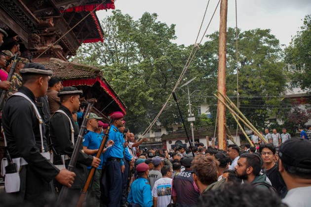 Indra Jatra Festival Started - Kathmandu Devotees erect the sacred ceremonial wooden pole known as Ya: Shi at Hanuman Dhoka Durbar Square, marking the beginning of the eight-day Indra Jatra festival in Kathmandu, Nepal, on September 23, 2026. The annual festival, one of the biggest celebrations in the Kathmandu Valley, is dedicated to Indra, the Hindu god of rain and heaven, and features traditional chariot processions, masked dances, religious rituals and cultural performances. The festival also includes processions of the living goddess Kumari through the historic streets of Kathmandu. Photo by Sunil Pradhan ABACAPRESS.COM Kathmandu Bagmati Nepal  Copyright: xSuniixPradhan ABACAx