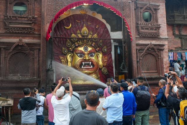 Indra Jatra Festival Started - Kathmandu Devotees clean the idol of Swet Bhairav on the first day of the eight-day Indra Jatra festival at Hanuman Dhoka Durbar Square in Kathmandu, Nepal, on September 23, 2026. The annual festival, one of the biggest celebrations in the Kathmandu Valley, is dedicated to Indra, the Hindu god of rain and heaven, and features traditional chariot processions, masked dances, religious rituals and cultural performances. The festival also includes processions of the living goddess Kumari through the historic streets of Kathmandu. Photo by Sunil Pradhan ABACAPRESS.COM Kathmandu Bagmati Nepal  Copyright: xSuniixPradhan ABACAx