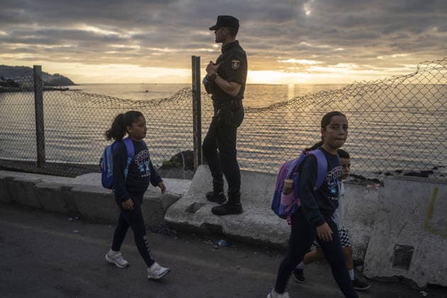 Spanish security forces reinforce Ceuta border amid mass crossing alerts CEUTA, SPAIN - SEPTEMBER 23: Members of the Spanish Civil Guard s Rapid Action Group (GRS) and National Police riot units maintain strict security vigilance along the Tarajal border crossing in the autonomous city of Ceuta, Spain on September 23, 2026. Following social media calls inciting a coordinated mass border-crossing attempt into European territory, the Spanish government deployed specialized reinforcement units from across mainland Spain to heighten border monitoring and prevent irregular entry attempts from neighboring Morocco amid the ongoing regional migration crisis. Jose Colon Anadolu Ceuta Spain. Editorial use only. Please get in touch for any other usa  Copyright: x2026xAnadoluxJosexColonx