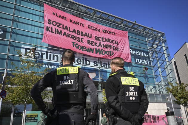 Environmental activists protest at CDU headquarters in Berlin BERLIN, GERMANY - SEPTEMBER 23: Environmental activists stage a protest at the Christian Democratic Union (CDU) headquarters, displaying banners on the building facade, in Berlin, Germany, on September 23, 2026. ROBIN WOOD activists climbed the CDU headquarters and unfurled the banner, criticizing the CDU-led federal government over what they described as insufficient action on climate protection and a lack of measures to counter the rise of the far-right Alternative for Germany (AfD). Halil Sagirkaya Anadolu Berlin Germany. Editorial use only. Please get in touch for any other usage.  Copyright: x2026xAnadoluxHalilxSagirkayax