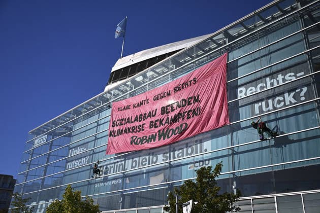 Environmental activists protest at CDU headquarters in Berlin BERLIN, GERMANY - SEPTEMBER 23: Environmental activists stage a protest at the Christian Democratic Union (CDU) headquarters, displaying banners on the building facade, in Berlin, Germany, on September 23, 2026. ROBIN WOOD activists climbed the CDU headquarters and unfurled the banner, criticizing the CDU-led federal government over what they described as insufficient action on climate protection and a lack of measures to counter the rise of the far-right Alternative for Germany (AfD). Halil Sagirkaya Anadolu Berlin Germany. Editorial use only. Please get in touch for any other usage.  Copyright: x2026xAnadoluxHalilxSagirkayax