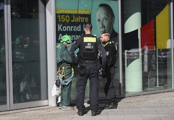 Environmental activists protest at CDU headquarters in Berlin BERLIN, GERMANY - SEPTEMBER 23: Police officers detain a ROBIN WOOD activist outside the Christian Democratic Union (CDU) headquarters during a protest in Berlin, Germany, on September 23, 2026. Police took extensive security measures around the building and detained protesters. The activists climbed the building and displayed banners criticizing the CDU-led federal government over what they described as insufficient action on climate protection and a lack of measures to counter the rise of the Alternative for Germany (AfD). Halil Sagirkaya Anadolu Berlin Germany. Editorial use only. Please get in touch for any other usage.  Copyright: x2026xAnadoluxHalilxSagirkayax