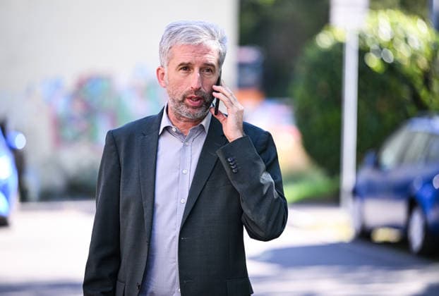 Tübingen, September 23, 2026: Mayor Boris Palmer, an independent, on his cell phone during a visit to the company BLUEmobility
