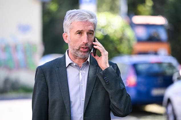 Tübingen, September 23, 2026: Mayor Boris Palmer, an independent, on his cell phone during a visit to the company BLUEmobility