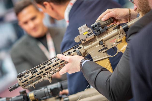 A view of the exhibition halls and the fairgrounds; the Heckler & Koch booth featuring handguns and machine guns; the Euro Defense Expo 2026 defense trade show in Essen, Germany; Essen, North Rhine-Westphalia, Germany; the fairgrounds