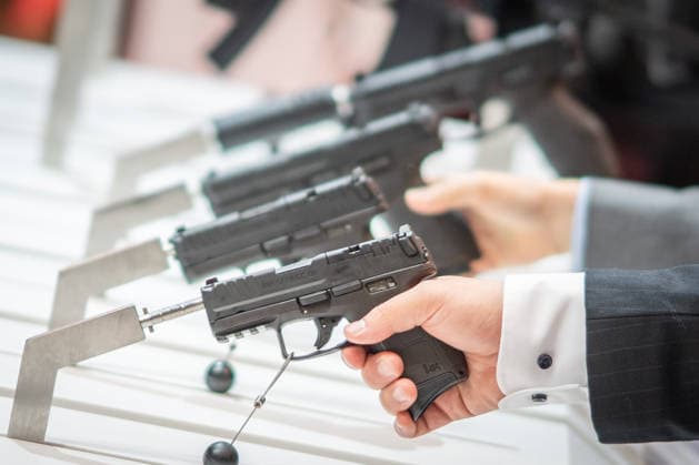 A view of the exhibition halls and the fairgrounds; the Heckler & Koch booth featuring handguns and machine guns; the Euro Defense Expo 2026 defense trade show in Essen, Germany; Essen, North Rhine-Westphalia, Germany; the fairgrounds