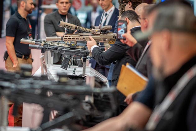A view of the exhibition halls and the fairgrounds; the Heckler & Koch booth featuring handguns and machine guns; the Euro Defense Expo 2026 defense trade show in Essen, Germany; Essen, North Rhine-Westphalia, Germany; the fairgrounds