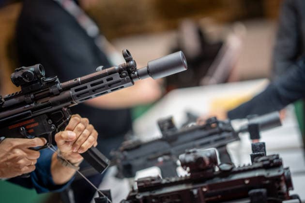 A view of the exhibition halls and the fairgrounds; the Heckler & Koch booth featuring handguns and machine guns; the Euro Defense Expo 2026 defense trade show in Essen, Germany; Essen, North Rhine-Westphalia, Germany; the fairgrounds