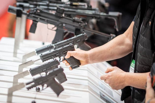 A view of the exhibition halls and the fairgrounds; the Heckler & Koch booth featuring handguns and machine guns; the Euro Defense Expo 2026 defense trade show in Essen, Germany; Essen, North Rhine-Westphalia, Germany; the fairgrounds