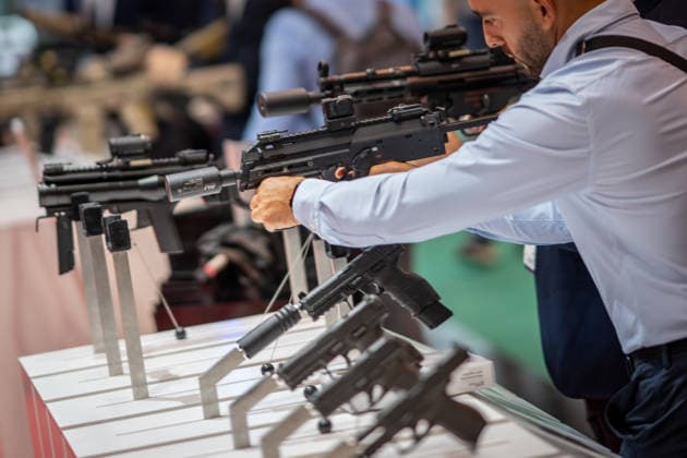 A view of the exhibition halls and the fairgrounds; the Heckler & Koch booth featuring handguns and machine guns; the Euro Defense Expo 2026 defense trade show in Essen, Germany; Essen, North Rhine-Westphalia, Germany; the fairgrounds