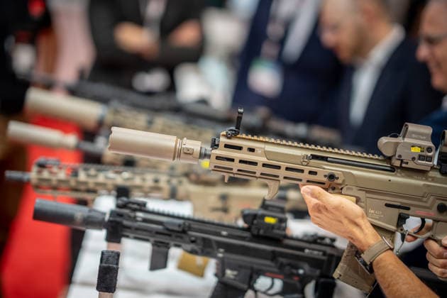 A view of the exhibition halls and the fairgrounds; the Heckler & Koch booth featuring handguns and machine guns; the Euro Defense Expo 2026 arms fair in Essen, Germany; Essen, North Rhine-Westphalia, Germany; the fairgrounds