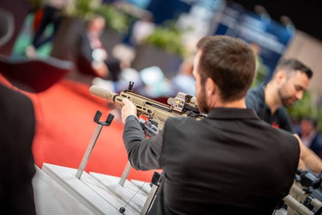 A view of the exhibition halls and the fairgrounds; the Heckler & Koch booth featuring handguns and machine guns; the Euro Defense Expo 2026 arms fair in Essen, Germany; Essen, North Rhine-Westphalia, Germany; the fairgrounds